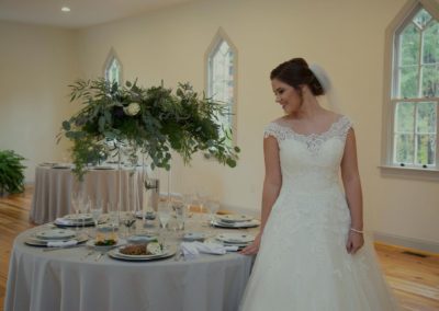 Happy Bride at wedding reception table in Salem Chapel